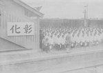 Students gathering to wave to Crown Prince Hirohito, who would be passing by aboard a train, Shoka Station, Taiwan, 20 Apr 1923