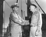 Captain Ralph Chrstie congratulating Lieutenant Commander John Moore of USS S-44 on the sinking of Kako, Brisbane, Australia, 23 Aug 1942