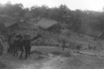 Members of US 5332nd Brigade (Provisional) at a village between Ningpawn and Pranglui, Burma, 3 Jan 1945