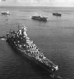 USS Missouri moored in Apra Harbor, Guam, Mariana Islands, 18 May 1945. Note hospital ship USS Hope behind Missouri and two Casablanca-class escort carriers at right.