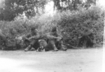 Sergeant Guilzi, Private First Class Fredericks, and Major Gus Edwards near Bhamo, Burma, circa late 1944