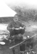 Major Gus Edwards of US 5332nd Brigade (Provisional) eating a field in the field, Nalong, Kachin, Burma, 24 Dec 1944