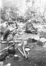 Lieutenant Pat Murphy, Lieutenant Dickinson, and Sergeant Galewicz of US 5332nd Brigade (Provisional) resting, Kachin, northern Burma, late Dec 1944
