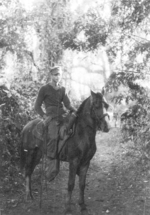 Private First Class Harper of US 5332nd Brigade (Provisional) atop a horse at the Shweli River bivouac, Kachin, Burma, Jan 1945