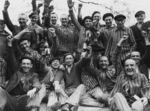 Polish prisoners celebrating, Dachau Concentration Camp, Germany, late Apr or early May 1945