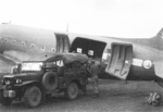 Loading cargo onto a C-47 aircraft, Lashio Airfield, Shan, Burma, Apr 1945; photo taken by personnel of US 5332nd Brigade (Provisional)