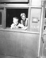 Children in a train car at a rail station, Calcutta, India, late 1944