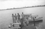 US Army Medical Detachment 1340 personnel with boat used for fishing expeditions during designated rest periods, Fiji, 1942-1944