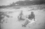 Harry Peters of US Army Medical Detachment 1340 and another serviceman resting at a beach, Fiji, 1942-1944