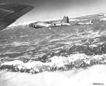 B-17 Fortresses of the 301st Bomb Group over the Italian Alps on their way to the rail yards in Vienna, Austria, 12 Mar 1945. Note the B-17 in the center with its ball turret replaced with the H2X ground scanning radar.