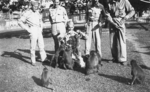 Off duty US servicemen playing with monkeys, Fiji, 1942-1944