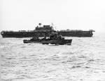 Destroyer USS Fanning maneuvers near USS Enterprise as both escort USS Hornet on the day the Doolittle Raid aircraft were launched, 18 Apr 1942. Photographed from cruiser USS Salt Lake City.