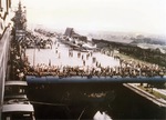 Many of the design features of the Essex-class can be seen here as the USS Yorktown squeezes through the locks of the Panama Canal, 11 Jul 1943. Notably, the deck-edge aircraft elevator is in the raised position.