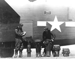 Navy photographers mates prepare aerial cameras for installation in a PB4Y-1P Liberator reconnaissance variant, circa Apr 1944, probably Momote Field on Los Negros in the Admiralty Islands.