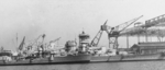 German hulk Amazone (left) and German heavy cruiser Admiral Hipper (right) at Blohm und Voss shipyard, Hamburg, Germany, 1939
