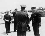 Commandant of the First Naval District Rear Admiral Felix Gygax and Commander, Naval Air Bases, First Naval District Commodore Dixie Kiefer arriving at Otis Field, Cape Cod, Massachusetts, United States 28 May 1945.