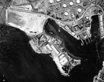 Straight down aerial view of the Pearl Harbor submarine base, 22 Aug 1941. The large C-shaped building is Fleet Headquarters where Admiral Kimmel’s office was. Note some of the fuel storage tanks are camouflage painted