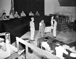 Japanese Naval Lieutenant (junior grade) Yoshinum Yoshihau hears the verdict of the War Crimes Commission on Guam, Mariana Islands, headed by Rear Admiral A.G. Robinson, 14 Nov 1946.