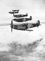 Six Spitfire Mark I’s of No. 19 Squadron, Royal Air Force, based at Duxford, Cambridgeshire, England flying in starboard echelon formation led by the Commanding Officer, Squadron Leader H.I. Cozens, 1938.