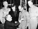 President Franklin Roosevelt presenting the Medal of Honor to Brigadier General James Doolittle for Doolittle’s role in leading a bomber attack on Tokyo one month earlier, White House, Washington DC, United States, 19 May 1942.