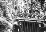 General Joseph Stilwell holding a roadside conference with Brigadier General Lewis Pick whose engineers were instrumental in the completion of the Burma Road, Burma, 1944.