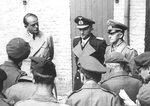 Germany’s Minister of Production Albert Speer, Großadmiral (and later President) Karl Dönitz, and Generaloberst Alfred Jodl, speak to British war correspondents the day after their arrest in Flensburg, Germany, 24 May 1945.