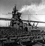 USS Yorktown (Essex-class) steaming across San Francisco Bay with a deck load of Jeeps, Dodge WC51 weapons carriers, and other vehicles, 15 Sep 1943.