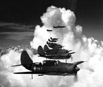 Curtiss SB2C Helldiver dive bombers of Bombing Squadron 17 on a training flight in the eastern United States, 26 Jun 1943.  Three weeks later, this squadron would deploy aboard USS Bunker Hill.