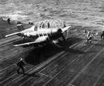 Chance-Vought F4U Corsair fighter powering up for takeoff from the USS Essex east of the Philippines, Dec 1944. Note the vapor streaks spinning off the propeller tips due to high humidity.