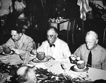 United States Army General Douglas MacArthur, President Franklin Roosevelt, and Admiral Chester Nimitz enjoying fresh tropical fruit at Schofield Barracks, Oahu, Hawaii, 27 Jul 1944.