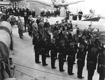 Royal Marines form an honor guard aboard HMS Prince of Wales to welcome US President Franklin Roosevelt aboard (upper right) for Sunday services during the Atlantic Conference, Placentia Bay, Newfoundland, 10 Aug 1941.