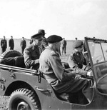 King George VI of the United Kingdom and Field Marshal Bernard Montgomery in a Jeep in the Netherlands, 12 Oct 1944.
