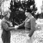 Field Marshal Bernard Montgomery (right) congratulating Victoria Cross recipient Sgt George Eardley, 2 Jan 1945. Sgt Eardley received the Victoria Cross for extreme heroism east of Overloon, Netherlands on 16 Oct 1944.