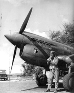 Commanding officer of Bellows Army Air Field, Major N.K. Health, alongside his P-40 Warhawk, “Mammy Yokum,” early 1940s.