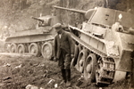Civilian with damaged BT-7 tanks, date unknown
