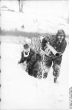 German Panzerschreck crew with gas masks, Soviet Union, Mar 1944, photo 3 of 4