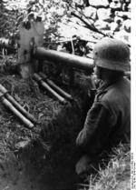 German soldier in a foxhole with Panzerschreck and Model 24 grenades, northern France, summer 1944