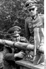General der Panzertruppen Adolf Kuntzen inspecting a Panzerschreck weapon, near Étretat, France, May 1944