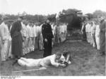 German Volkssturm personnel practicing with a Panzerschreck weapon against an obsolete German Grosstraktor experimental tank, Germany, Oct 1944