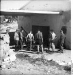 German troops pushing a 5 cm PaK 38 gun into a building, Italy, 1944, photo 1 of 2