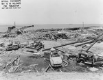 Dockside facilities and automobiles demolished by the munitions explosion at Port Chicago, California, United States, 17 Jul 1944. 18 Jul 1944 photo.