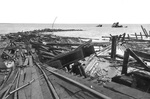 Demolished pier and wreckage of the Victory-ship SS Quinault Victory after a massive munitions explosion at Port Chicago, California, United States, 17 Jul 1944. 18 Jul 1944 photo.