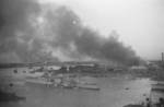 Smoke rising from Shanghai, China, Aug-Sep 1937, photo 2 of 2; note USS Augusta in foreground left and HMS Suffolk in foreground right