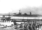 Cruiser USS Northampton arriving at Pearl Harbor, Hawaii the day after the attack, 8 Dec 1941. Note her false bow wave camouflage. Photo 1 of 2.