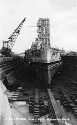 USS Nevada in Drydock 2 at the Puget Sound Naval Shipyard, Bremerton, Washington, United States for repairs following the Pearl Harbor Attack. Nevada was in drydock from 11 May to 30 Nov 1942.