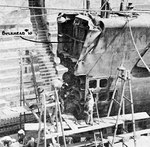 USS Growler’s bow with the damaged sections removed prior to a replacement bow being fitted into place at the South Brisbane Drydock, Brisbane, Queensland, Australia, Apr 1943. Note crumpled sections.
