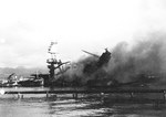 Yard Craft YG-21 alongside battleship USS Arizona fighting Arizona’s fires, 7 Dec 1941 Pearl Harbor, Hawaii.