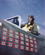 Francis Gabreski posing in the cockpit of his P-47 Thunderbolt fighter, shortly after 5 Jul 1944