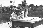 Australian General Sir Thomas Blamey signing the surrender for Japanese forces throughout the Dutch East Indies, Morotai, 9 Sep 1945.