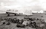 Mitsubishi G3M ‘Nell’ bomber in surrender paint scheme abandoned at Seletar Airfield, Singapore, 1945. Note the Nakajima L2D ‘Tabby’ aircraft beyond, license-built copy of the Douglas DC-3, also in surrender paint.